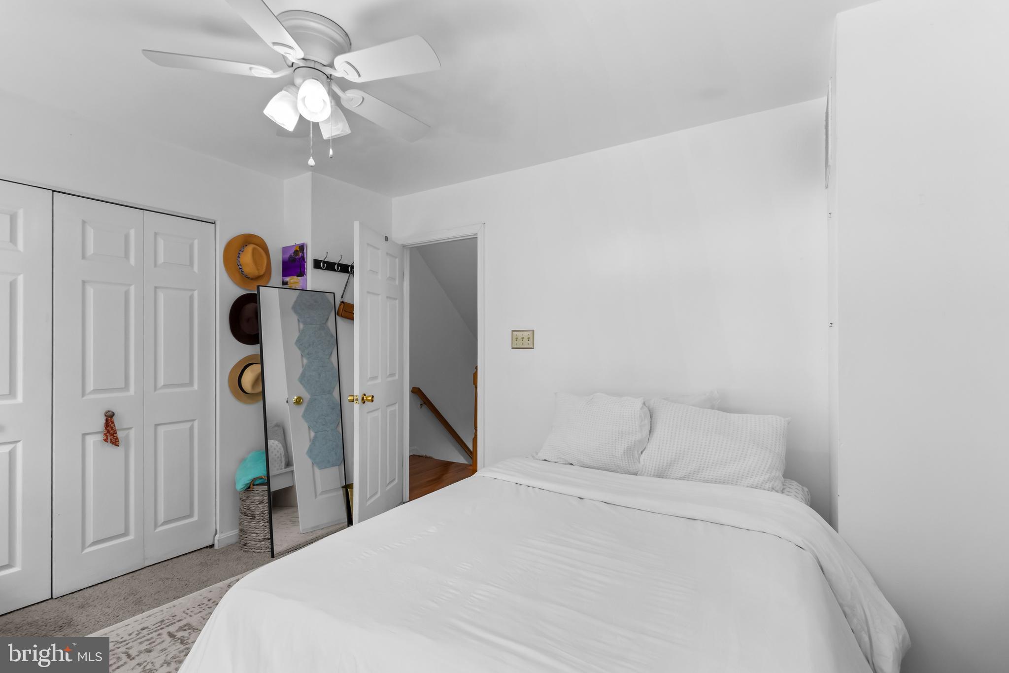 13 Bank Spring Court Owings Mills, MD 21117 - Photo 25 of 50 a bedroom with a large bed and a chandelier