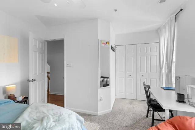 a bedroom with a bed and a table