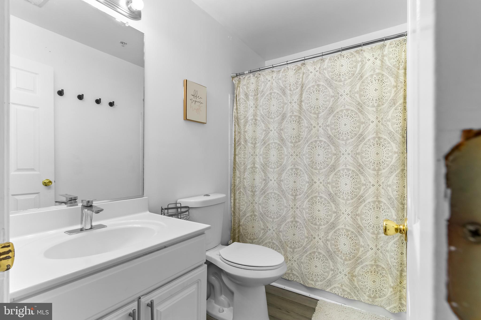 13 Bank Spring Court Owings Mills, MD 21117 - Photo 30 of 50 a bathroom with a sink and a mirror