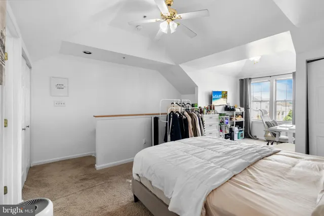 a bed room with a bed and a large window