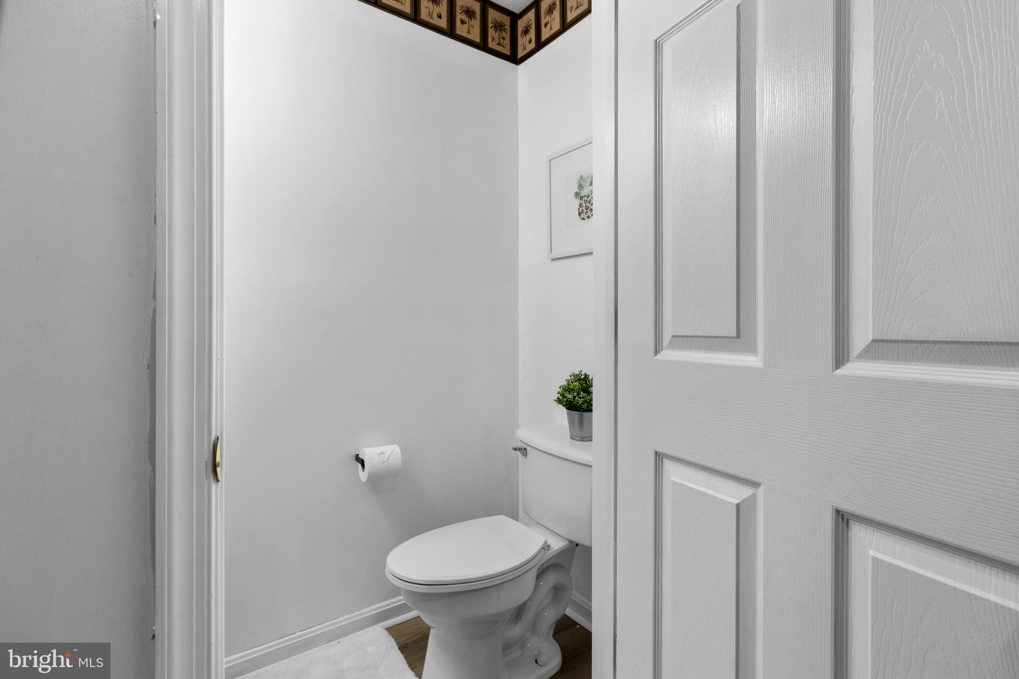 13 Bank Spring Court Owings Mills, MD 21117 - Photo 41 of 50 a bathroom with a granite countertop toilet and a sink