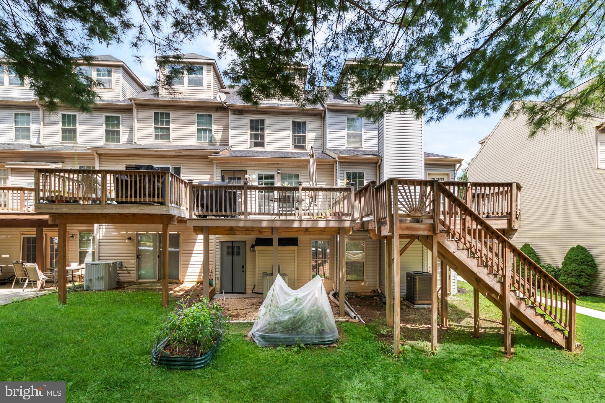 13 Bank Spring Court Owings Mills, MD 21117 - Photo 47 of 50 a front view of a house with a yard and staircase