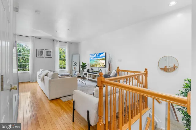 a living room with furniture and windows