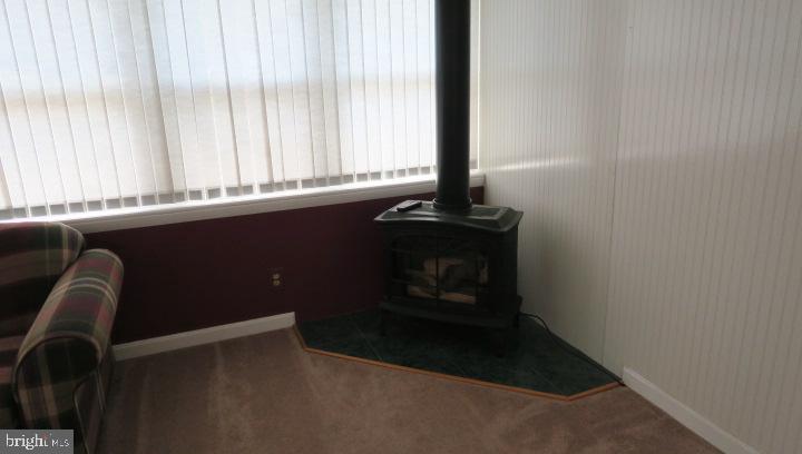 4106 Perry View Road Baltimore, MD 21236 - Photo 20 of 34 Gas stove fireplace in Sunroom