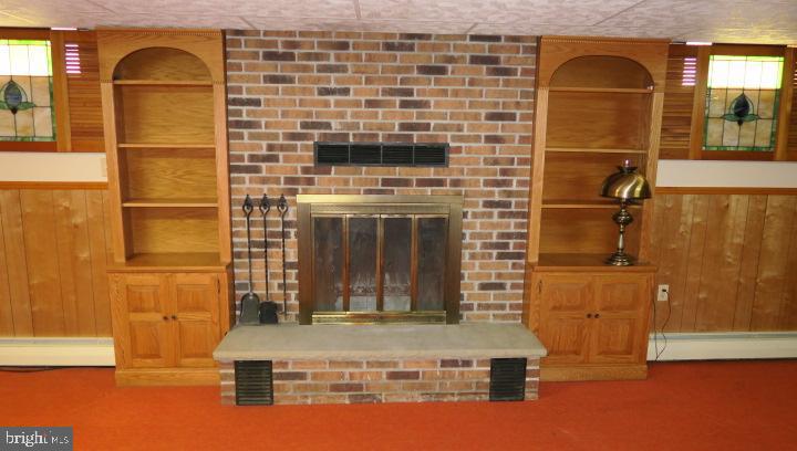 4106 Perry View Road Baltimore, MD 21236 - Photo 24 of 34 Lower level woodburning fireplace with heatilator