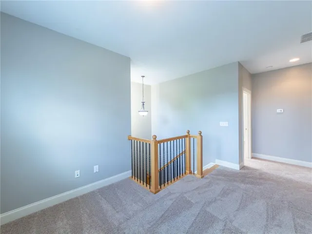 an empty room with staircase