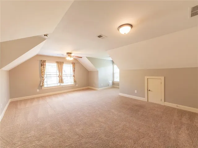 a view of a room with window and stairs