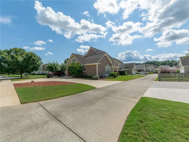 a view of street with houses in background