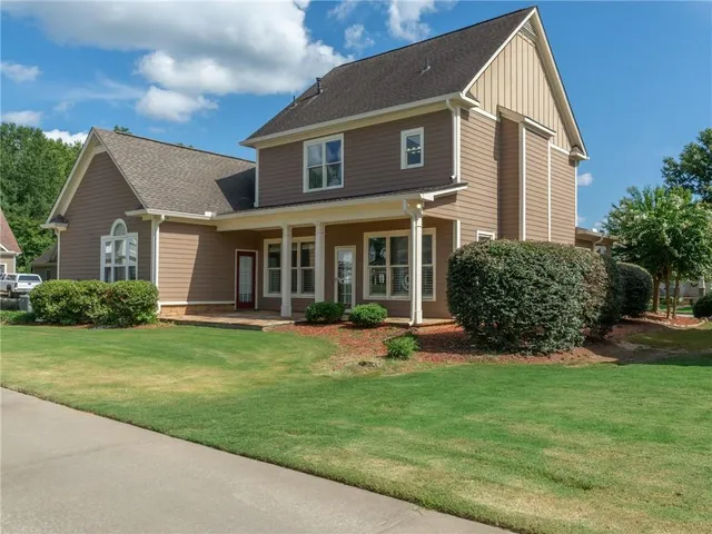 a front view of a house with a yard