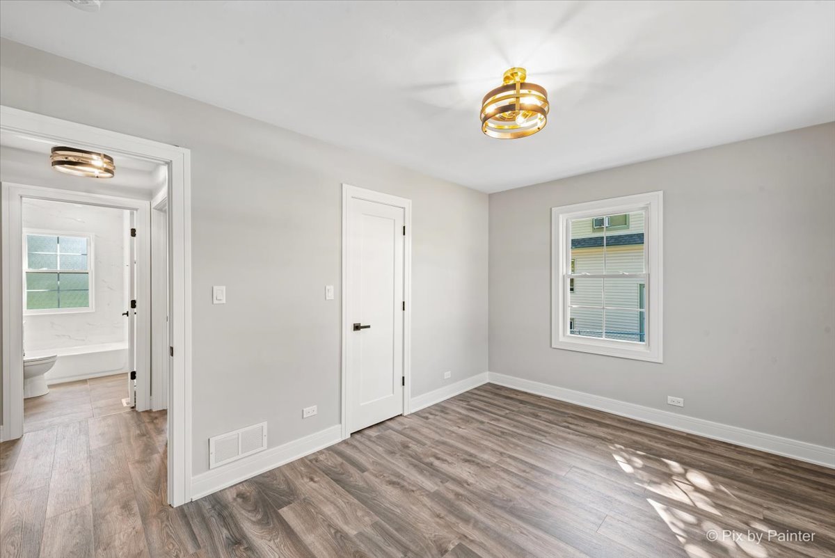 229 West Harding Road Lombard, IL 60148 - Photo 13 of 29 wooden floor in an empty room with a window