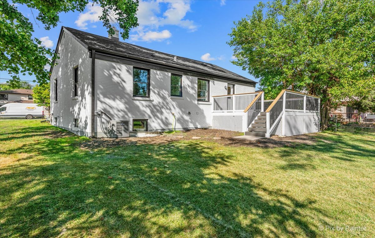 229 West Harding Road Lombard, IL 60148 - Photo 24 of 29 a view of a house with backyard and sitting area