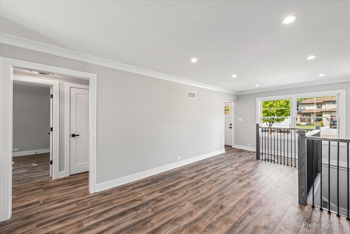 229 West Harding Road Lombard, IL 60148 - Photo 9 of 29 wooden floor in an empty room with a window