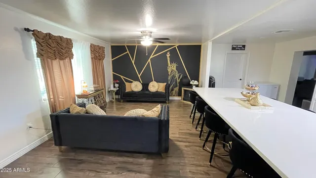 a view of a dining room with furniture window and wooden floor