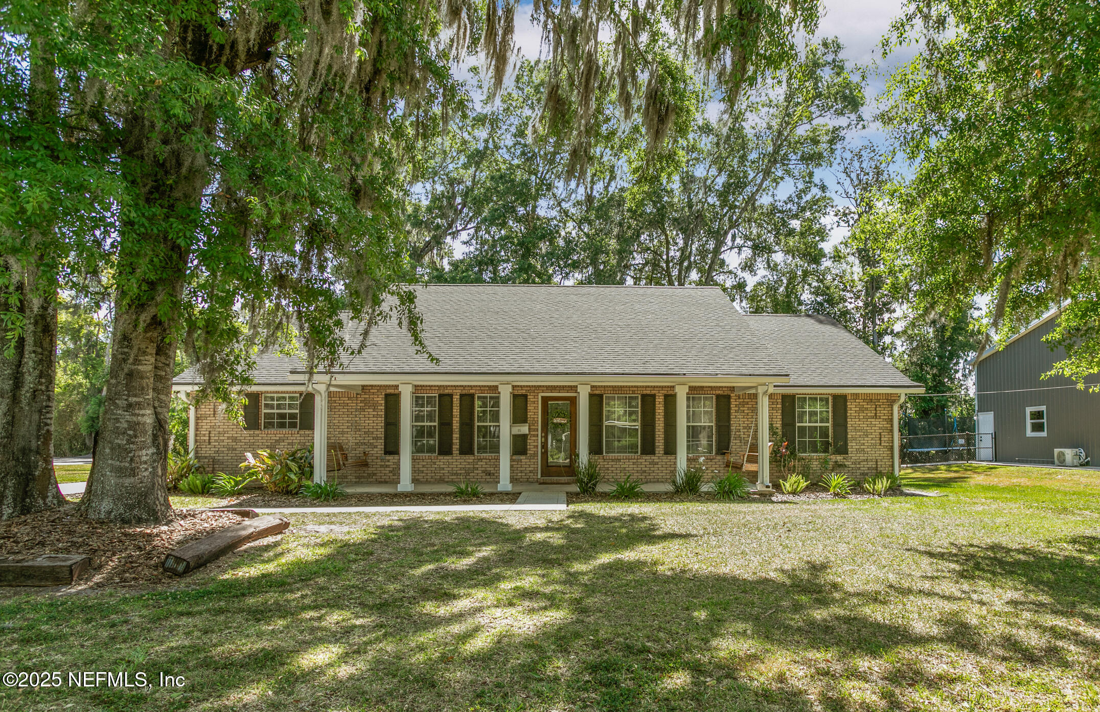 front view of a house with a big yard