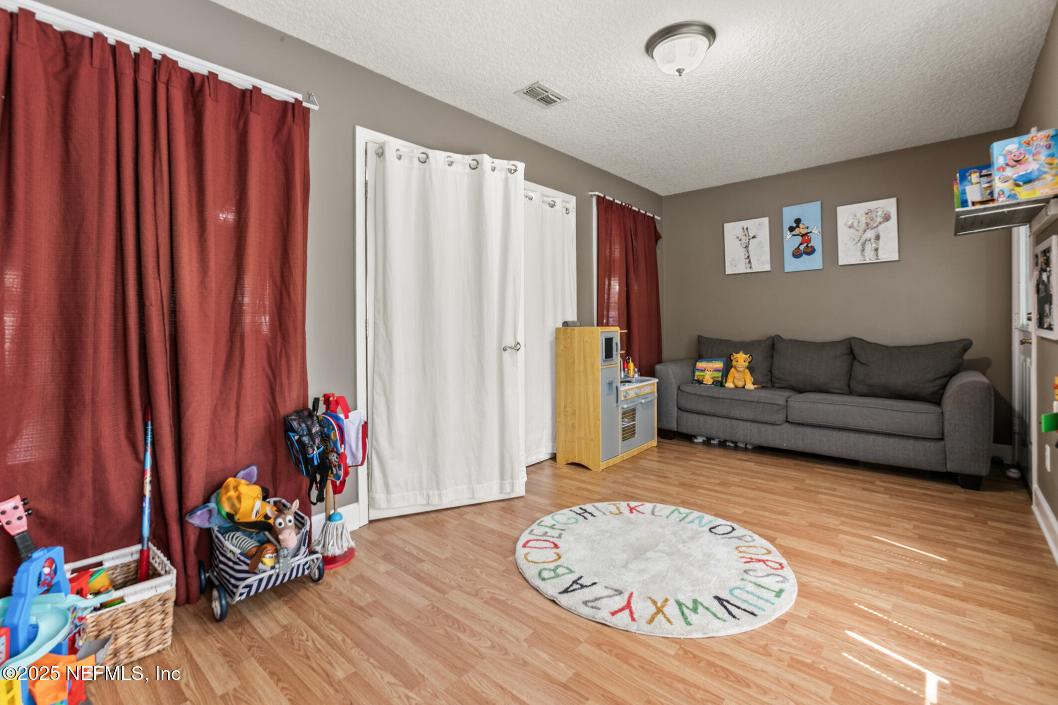 85 Murray Street North Baldwin, FL 32234 - Photo 13 of 49 a living room with furniture and a wooden floor