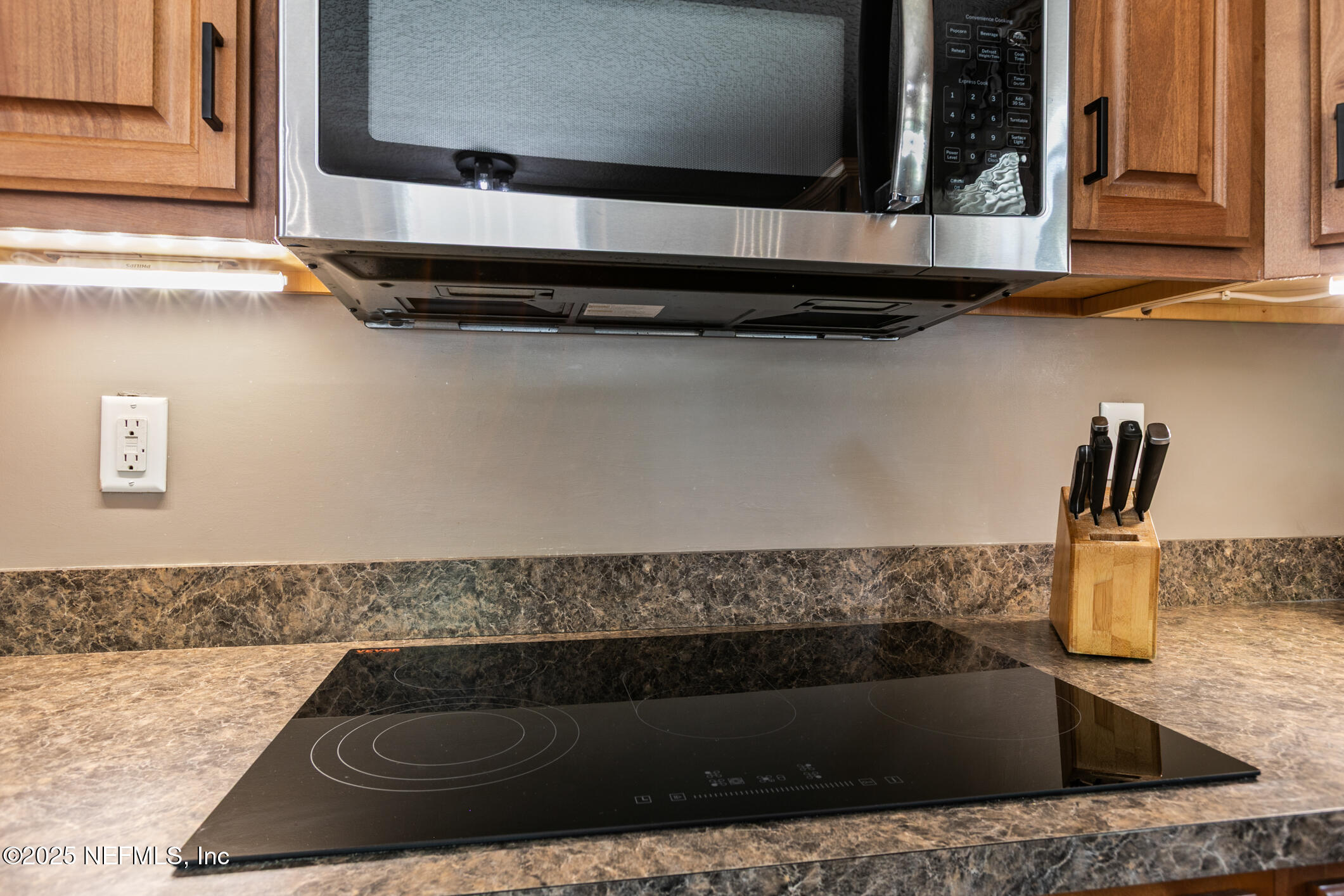 85 Murray Street North Baldwin, FL 32234 - Photo 19 of 49 a kitchen with granite countertop a sink and a stove