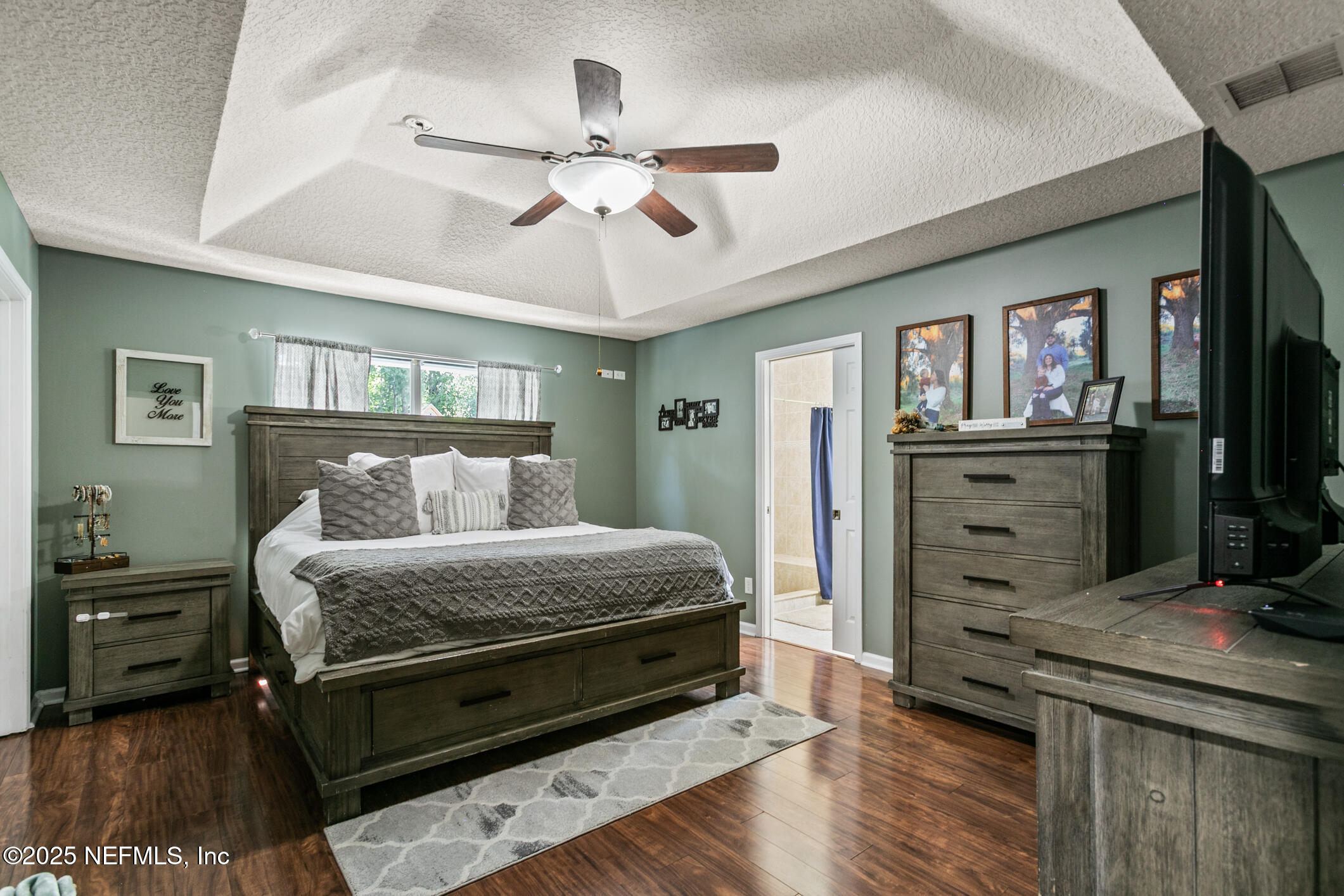 85 Murray Street North Baldwin, FL 32234 - Photo 22 of 49 a bedroom with a bed and wooden floor