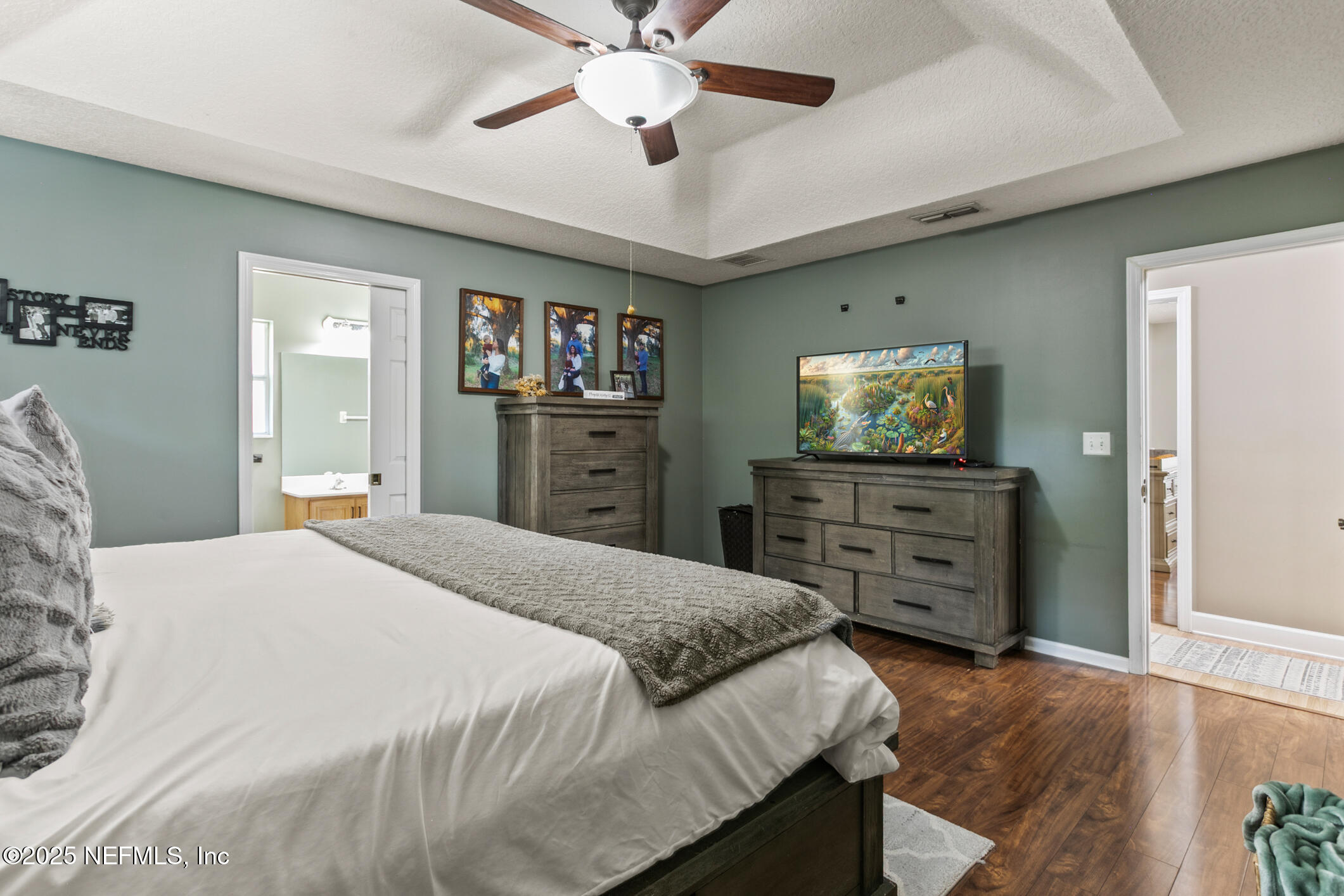 85 Murray Street North Baldwin, FL 32234 - Photo 23 of 49 a bedroom with a bed and a dresser