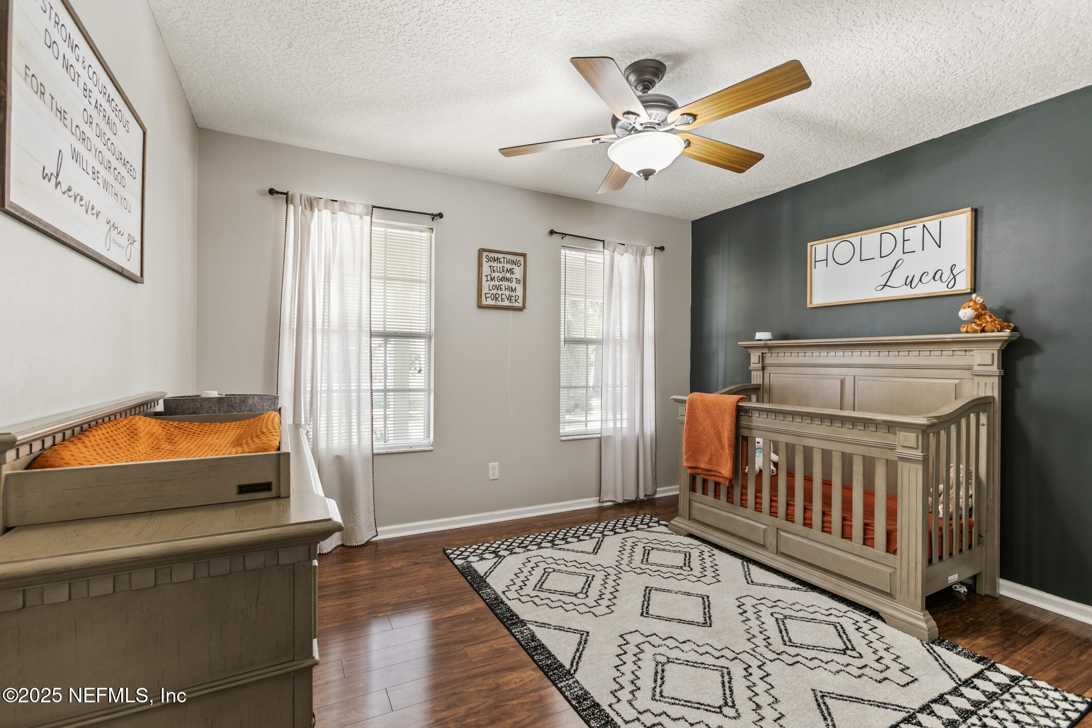 85 Murray Street North Baldwin, FL 32234 - Photo 28 of 49 a bedroom with furniture and a window