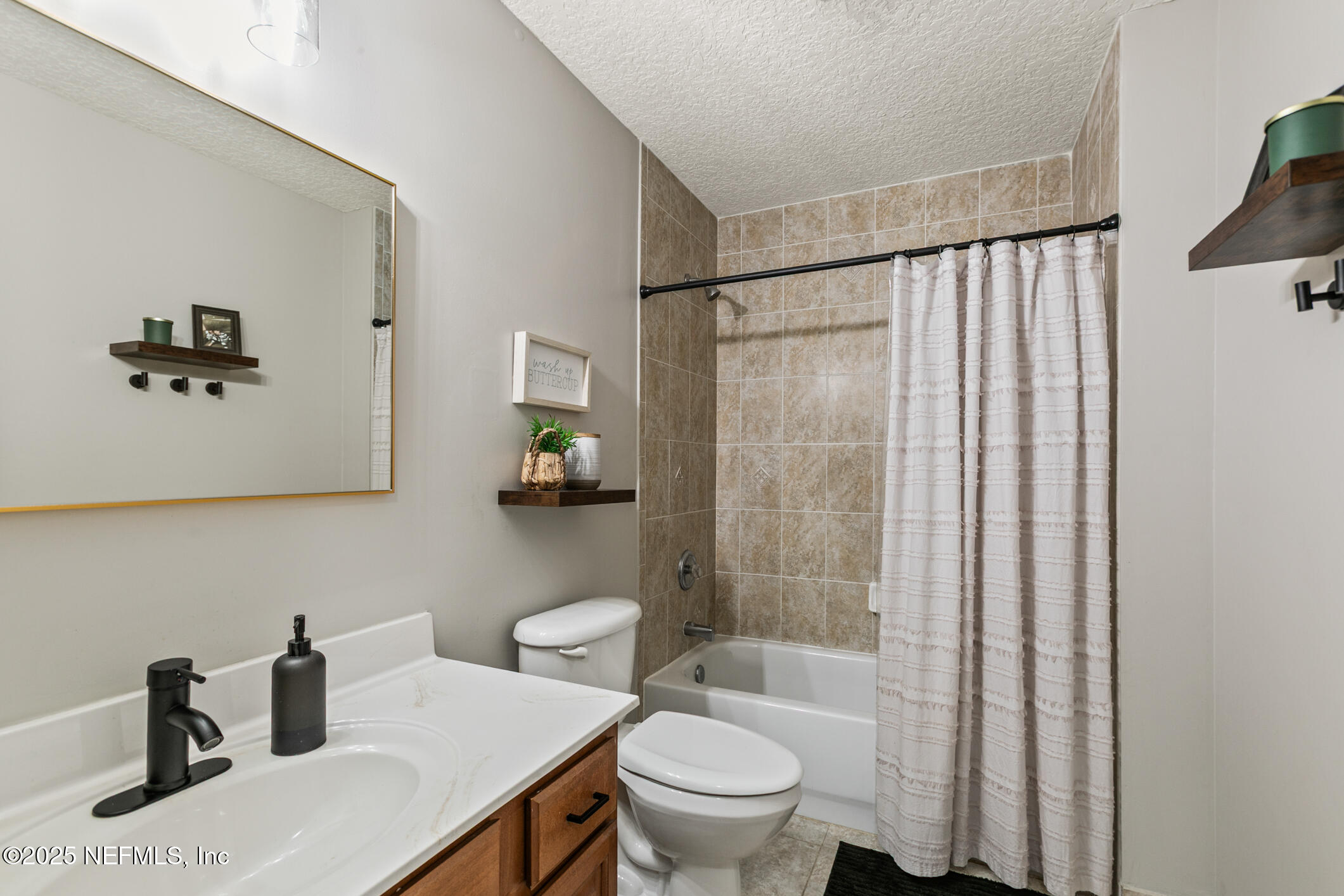 85 Murray Street North Baldwin, FL 32234 - Photo 30 of 49 a bathroom with a sink toilet and shower