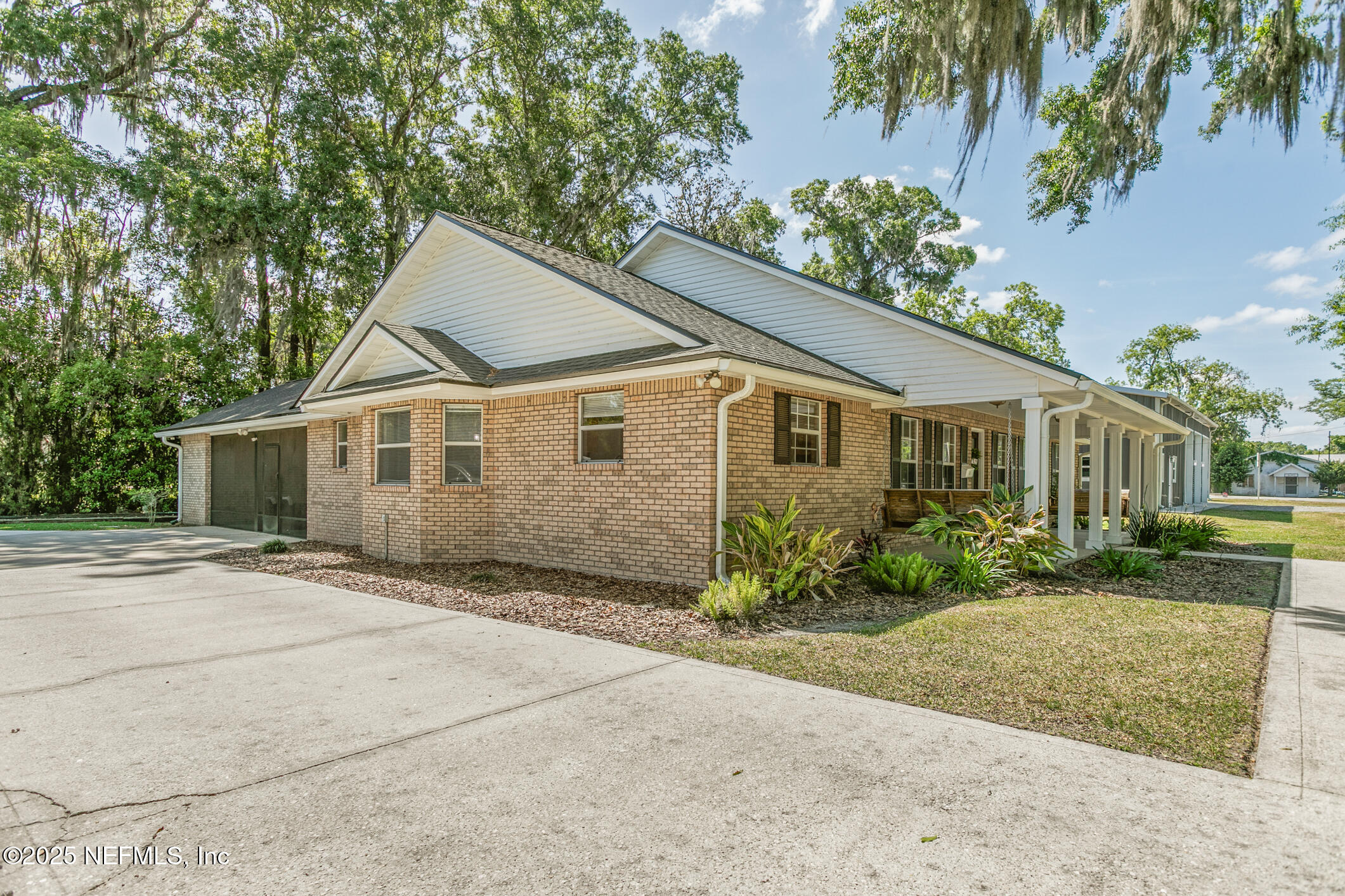 85 Murray Street North Baldwin, FL 32234 - Photo 3 of 49 a view of a yard in front of a house with plants