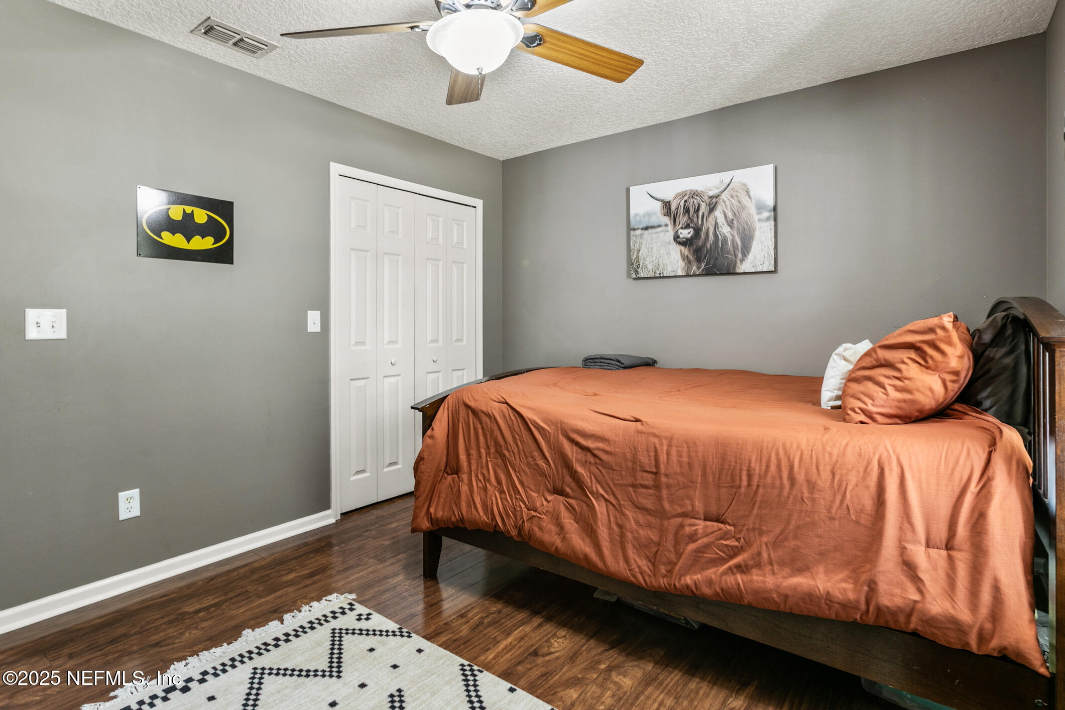 85 Murray Street North Baldwin, FL 32234 - Photo 32 of 49 a bedroom with a bed and painting on the wall