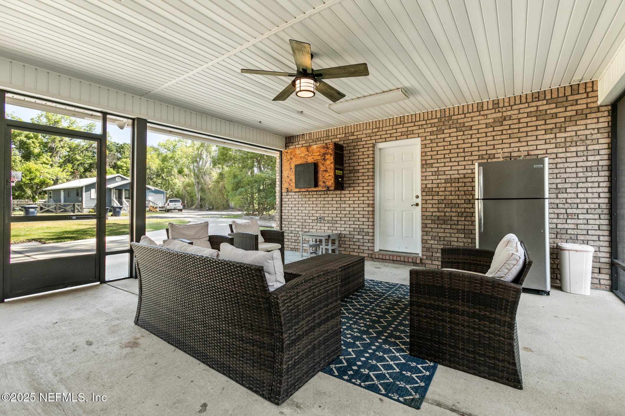 85 Murray Street North Baldwin, FL 32234 - Photo 37 of 49 a living room with furniture and a large window