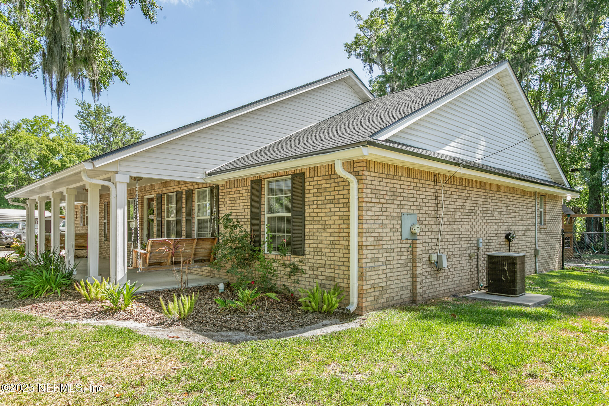 85 Murray Street North Baldwin, FL 32234 - Photo 4 of 49 a view of a house with backyard and a garden