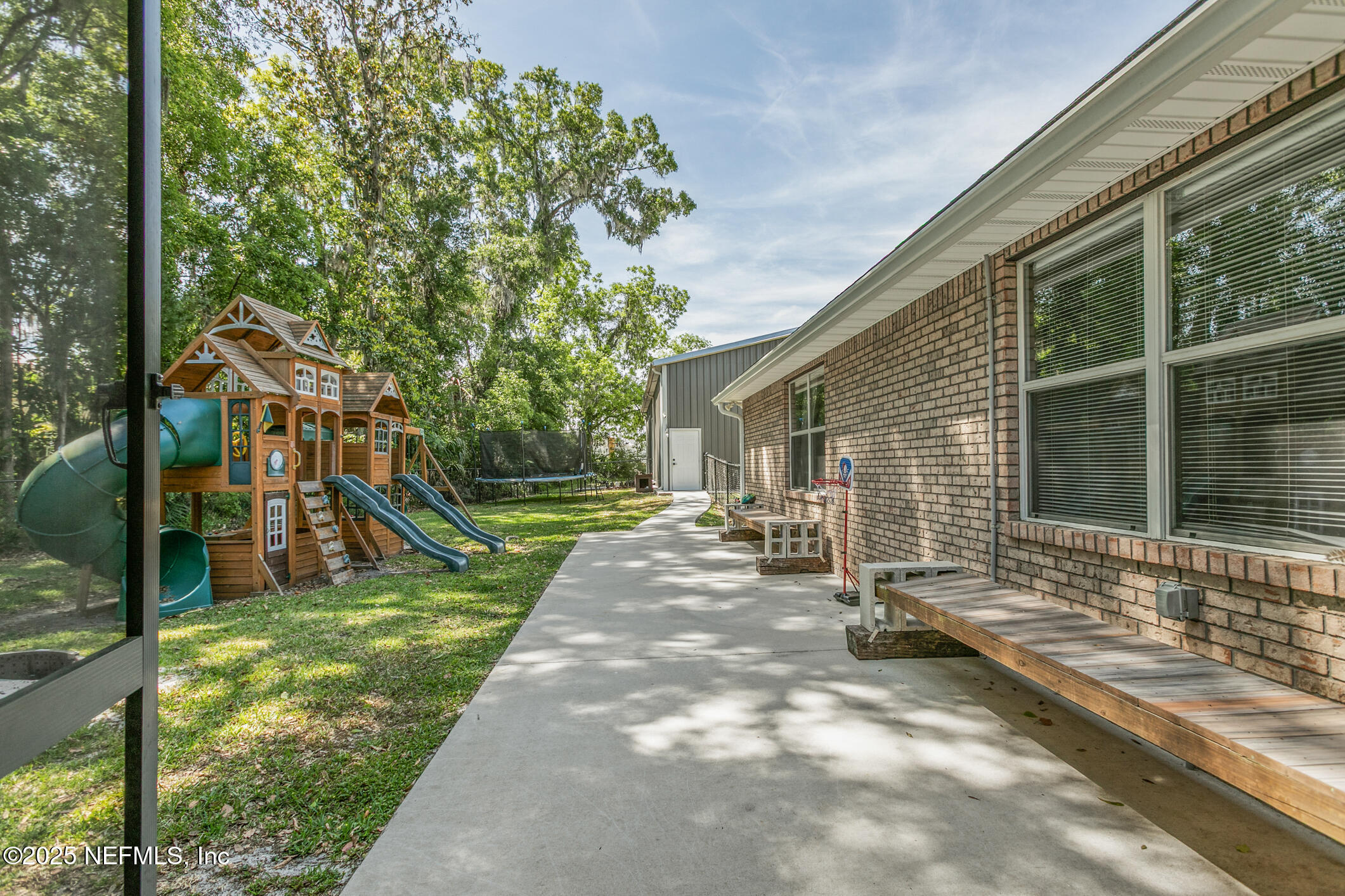 85 Murray Street North Baldwin, FL 32234 - Photo 42 of 49 a view of a house with backyard and sitting area