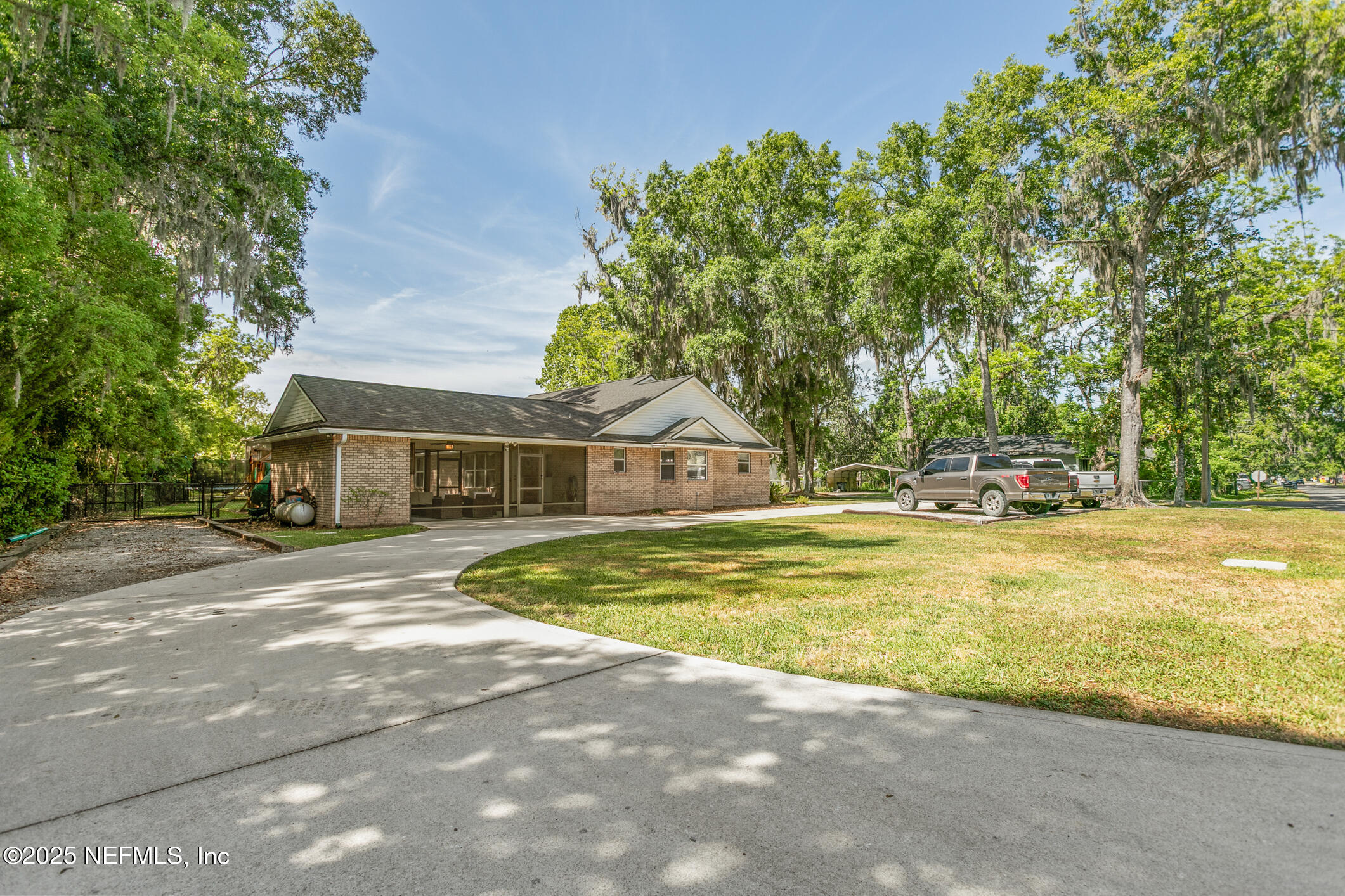 85 Murray Street North Baldwin, FL 32234 - Photo 47 of 49 a view of a house with pool and a yard