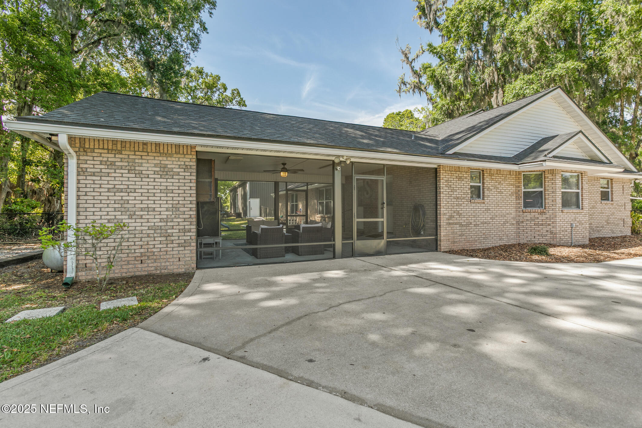 85 Murray Street North Baldwin, FL 32234 - Photo 48 of 49 a front view of a house with a garden and plants