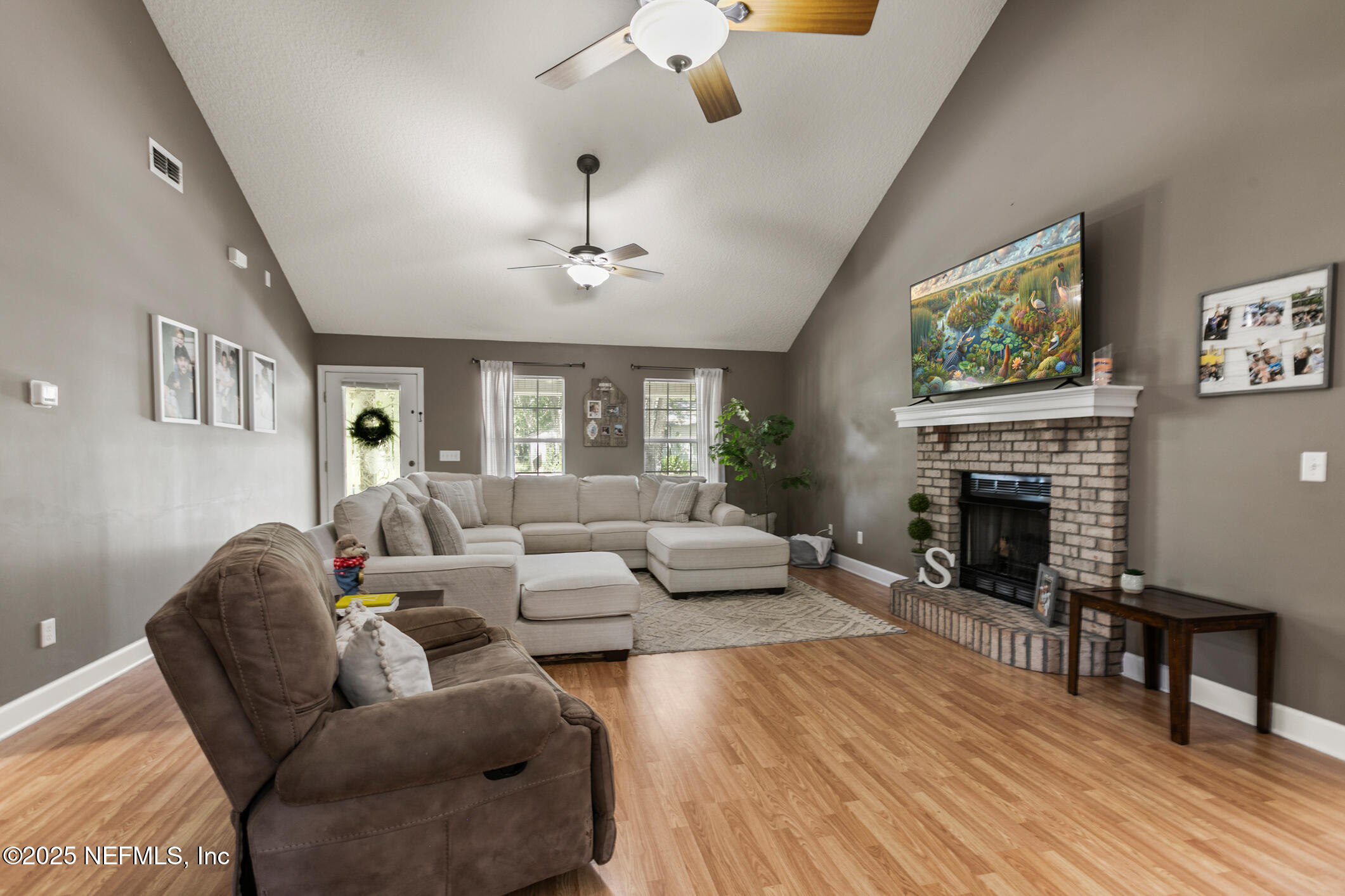85 Murray Street North Baldwin, FL 32234 - Photo 8 of 49 a living room with furniture and a fireplace