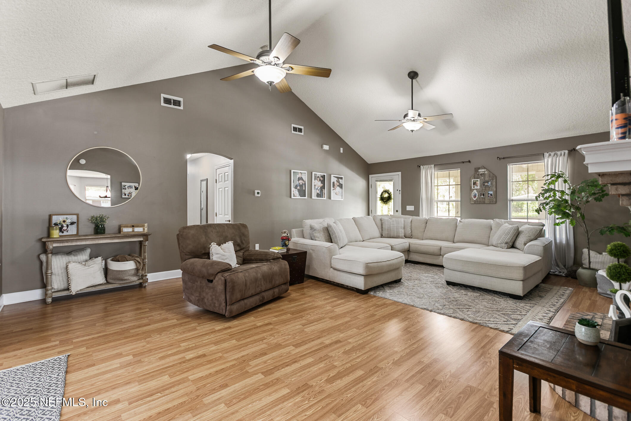 85 Murray Street North Baldwin, FL 32234 - Photo 9 of 49 a living room with furniture and a chandelier