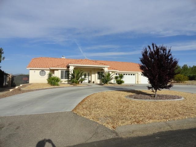 16478 Chippewa Road Apple Valley, CA 92307 - Photo 1 of 1 a view of a street with a building in the background