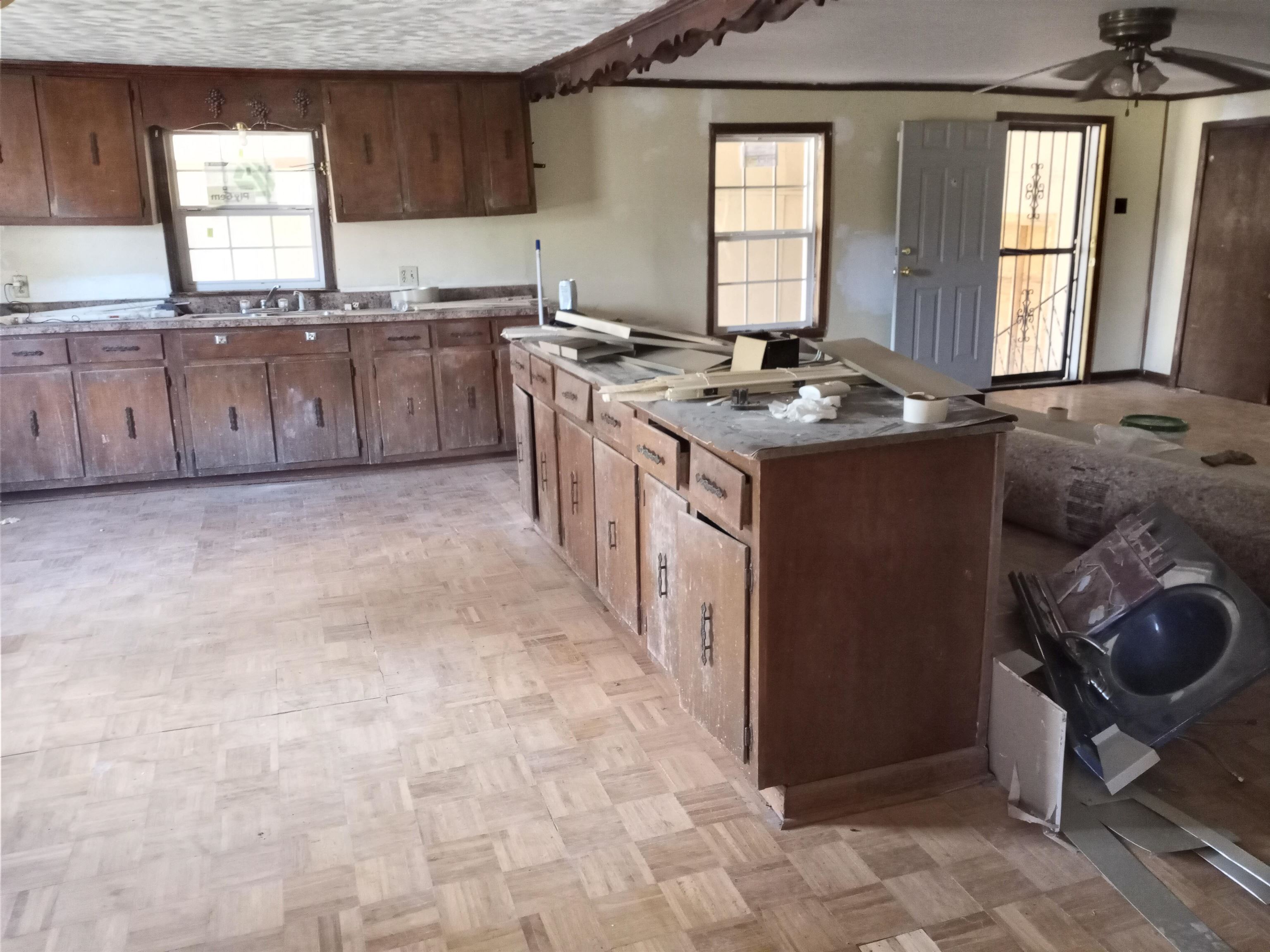 417 West Ripley Avenue Covington, TN 38019 - Photo 2 of 7 a kitchen with stainless steel appliances granite countertop a sink stove and cabinets