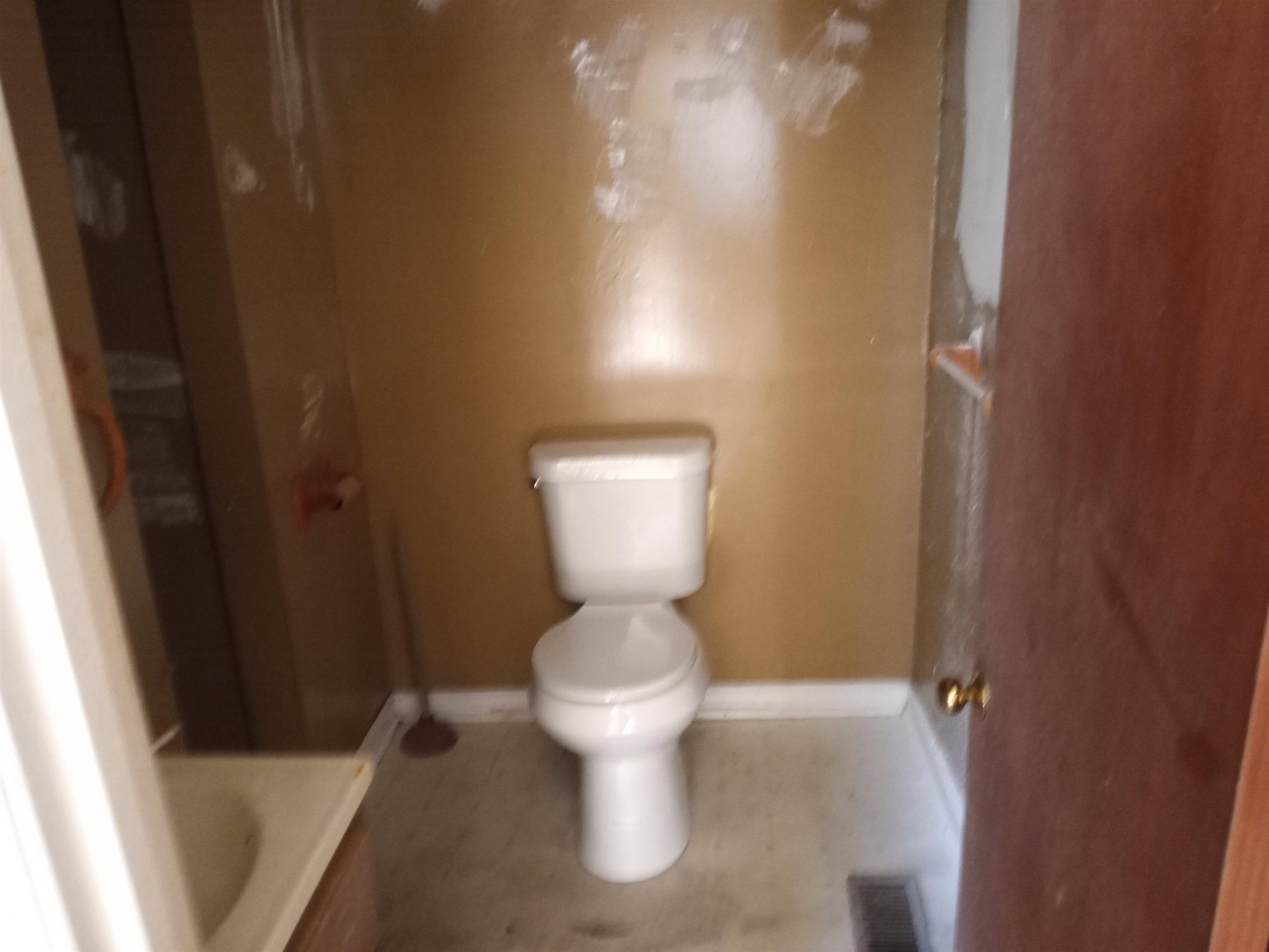 417 West Ripley Avenue Covington, TN 38019 - Photo 7 of 7 a bathroom with a toilet and a sink