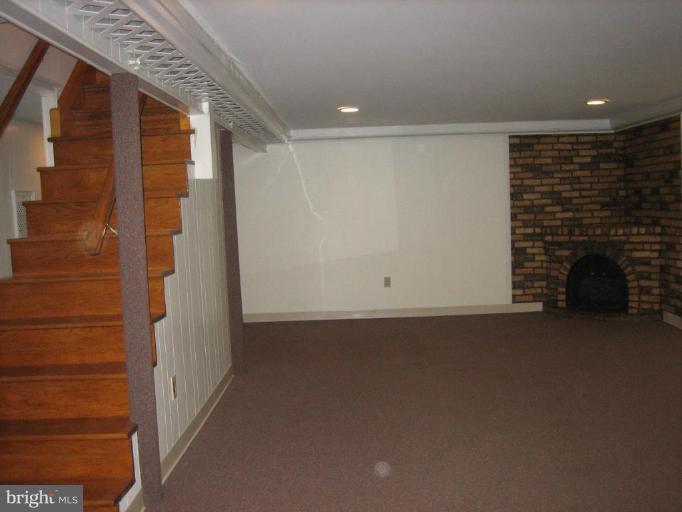 5767 Middleburg Road Keymar, MD 21757 - Photo 22 of 25 a view of empty room with fireplace
