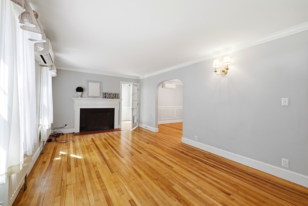 32 Lincoln Road Longmeadow, MA 01106 - Photo 16 of 36 a view of empty room with wooden floor and fireplace