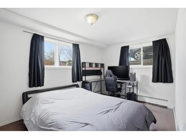 a bedroom with a bed and furniture
