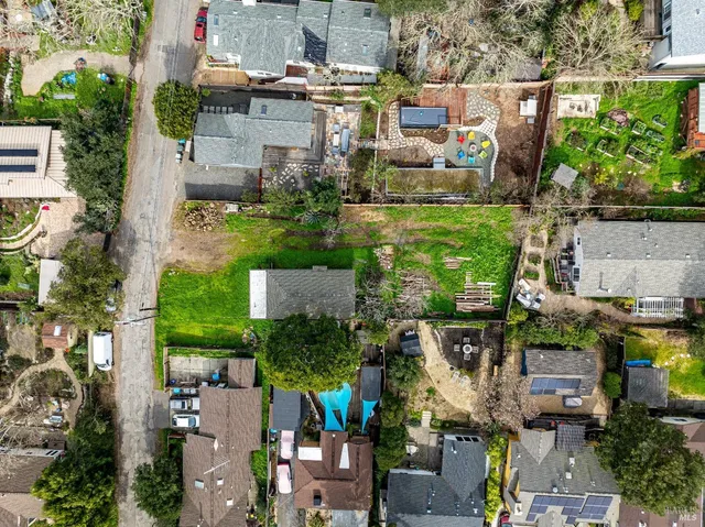 an aerial view of houses with outdoor space