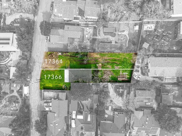 a sign that is next to a brick wall