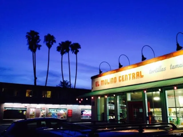 a view of a cafe with a table and chairs