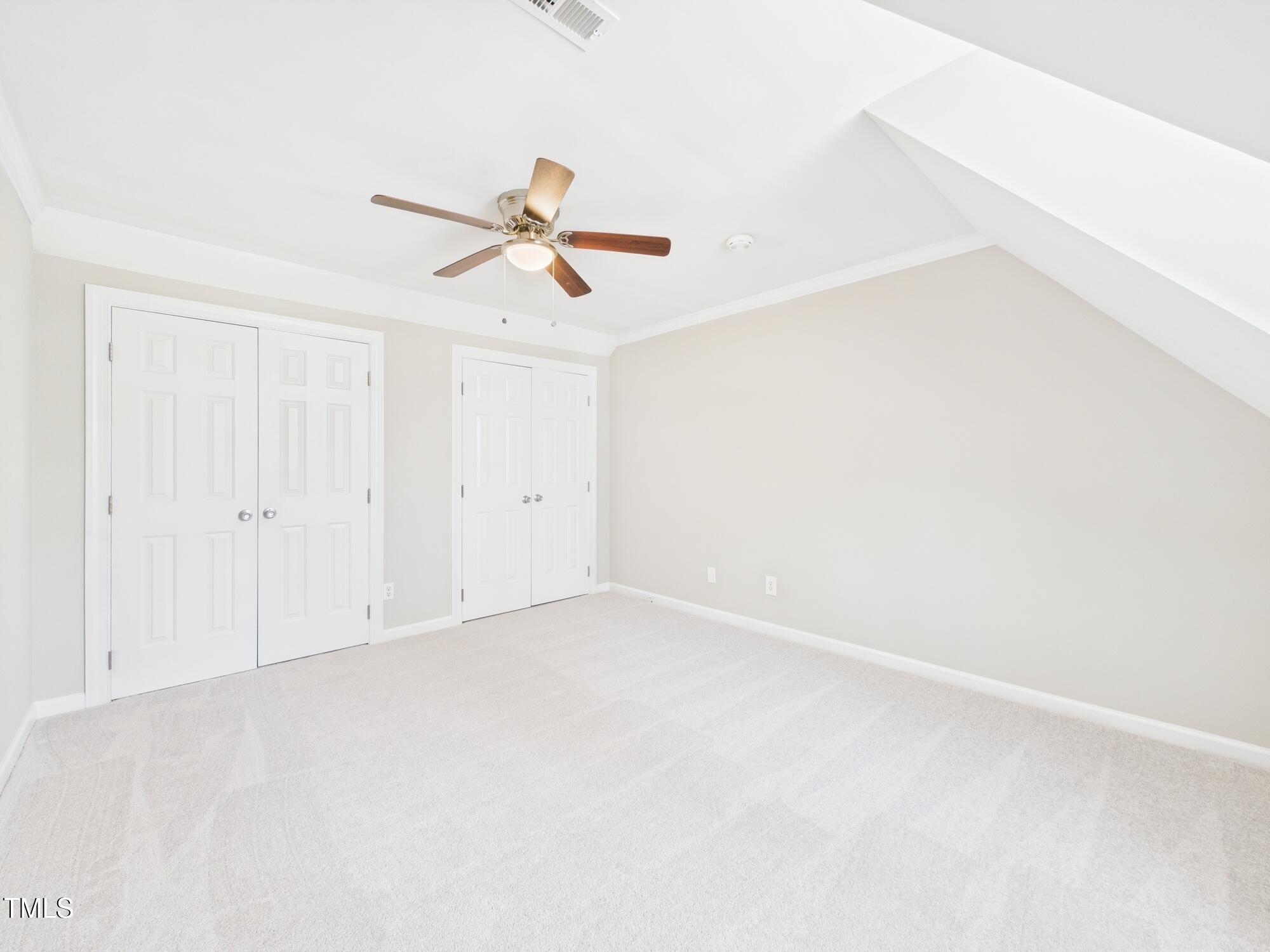 7117 Sandringham Drive Raleigh, NC 27613 - Photo 40 of 54 an empty room with a empty space and a ceiling fan