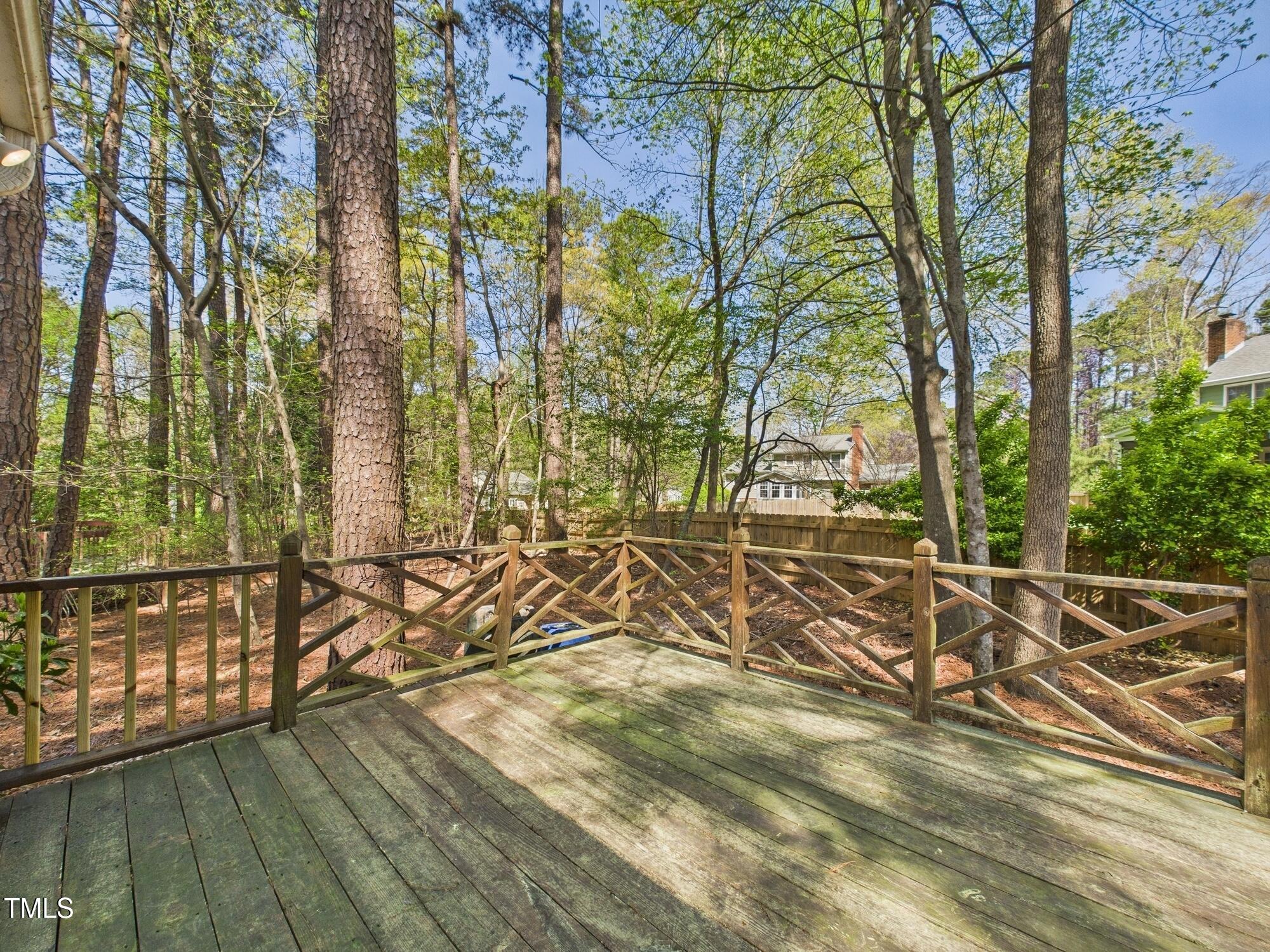 7117 Sandringham Drive Raleigh, NC 27613 - Photo 44 of 54 a view of wooden floor with a table and chairs