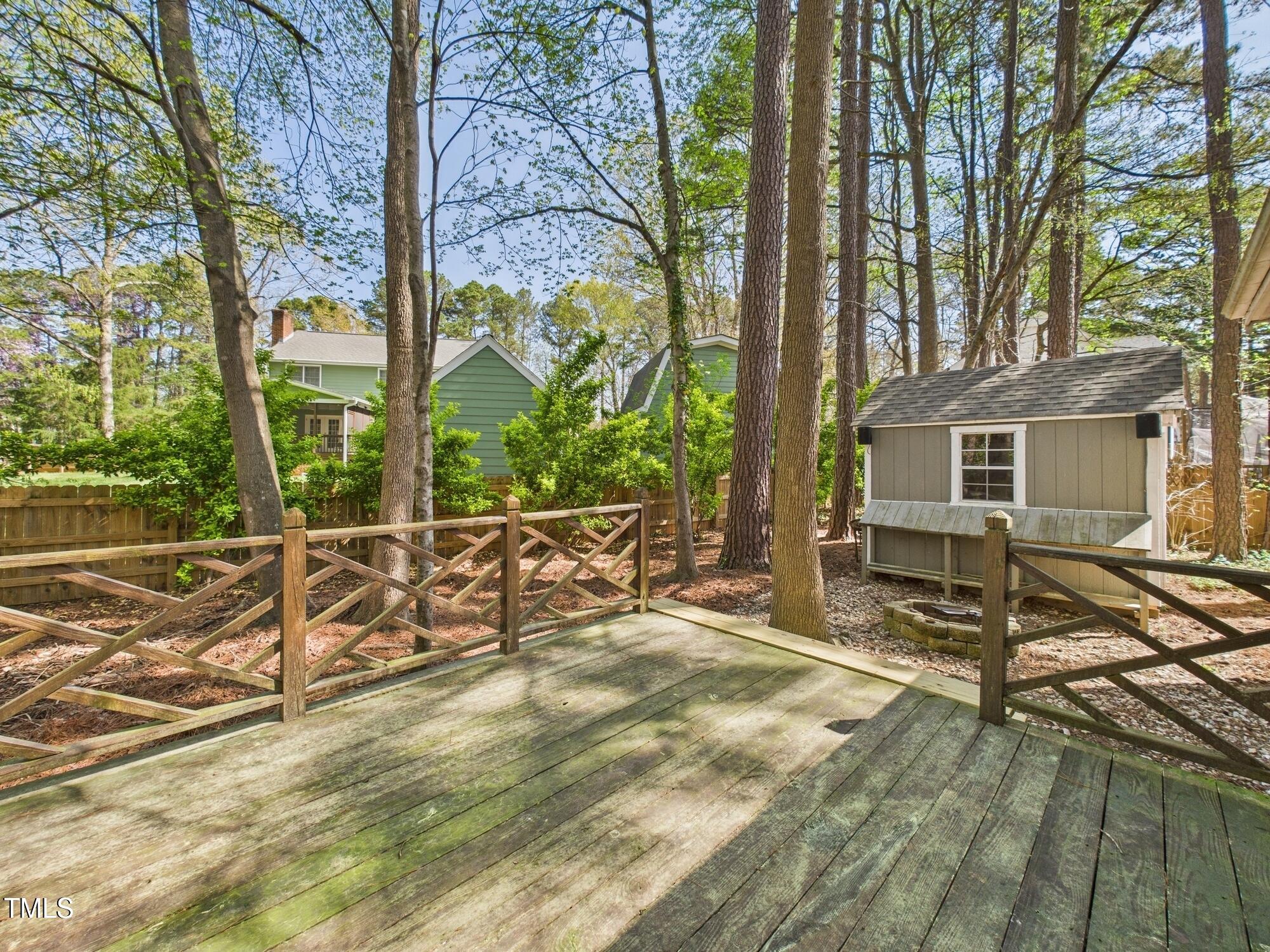 7117 Sandringham Drive Raleigh, NC 27613 - Photo 45 of 54 a view of a house with backyard and sitting area