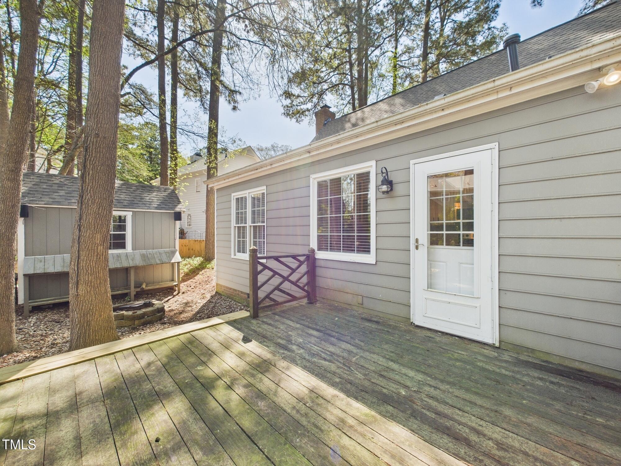 7117 Sandringham Drive Raleigh, NC 27613 - Photo 46 of 54 a view of a house with backyard