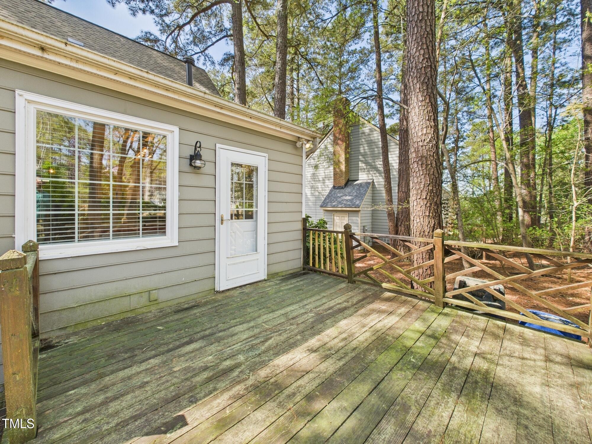 7117 Sandringham Drive Raleigh, NC 27613 - Photo 47 of 54 a view of a house with wooden fence