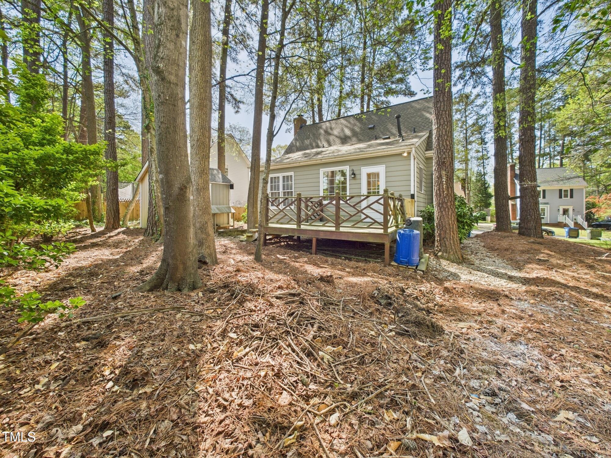7117 Sandringham Drive Raleigh, NC 27613 - Photo 52 of 54 a view of a house with a garden