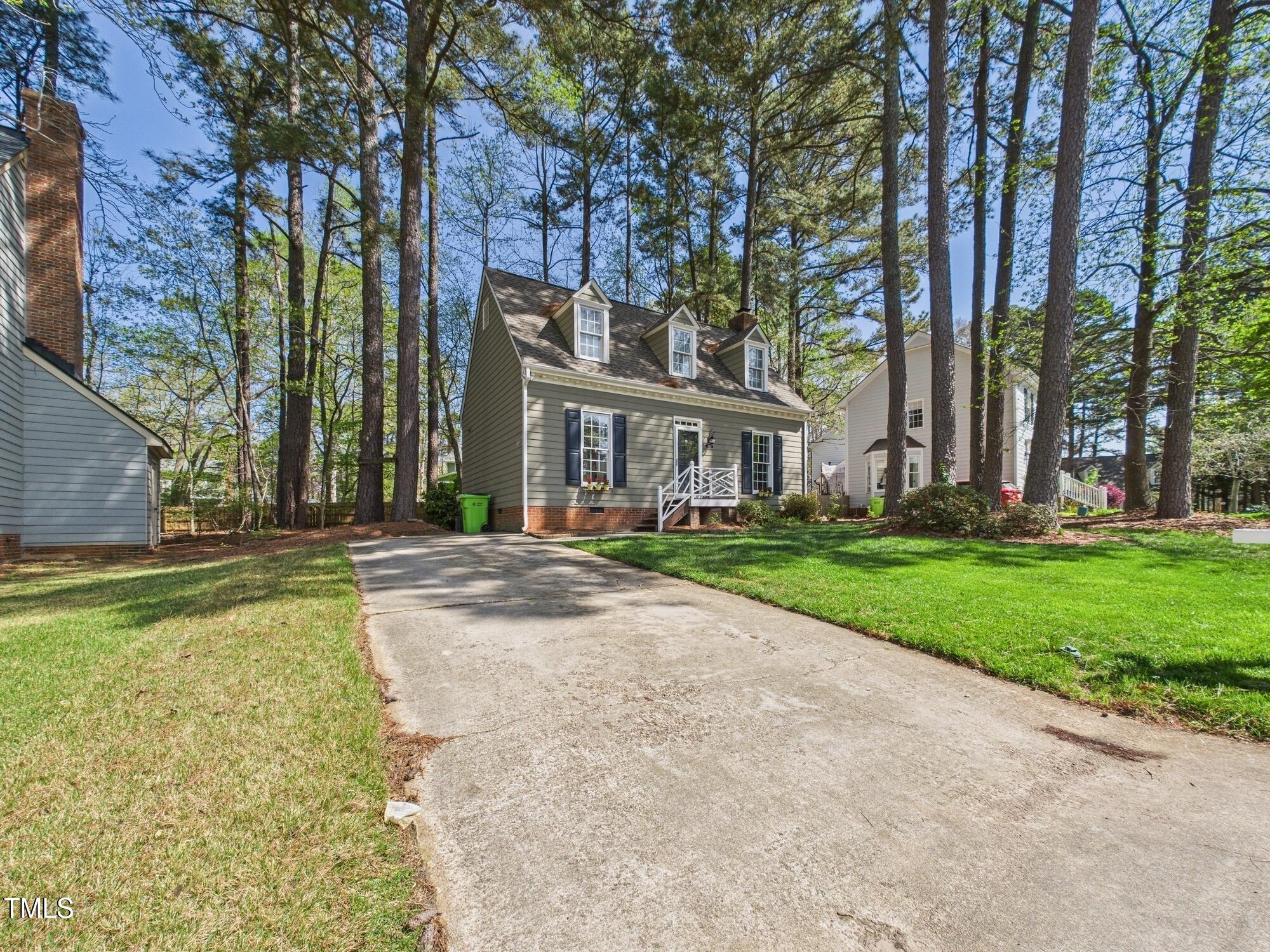 7117 Sandringham Drive Raleigh, NC 27613 - Photo 6 of 54 front view of house with a yard