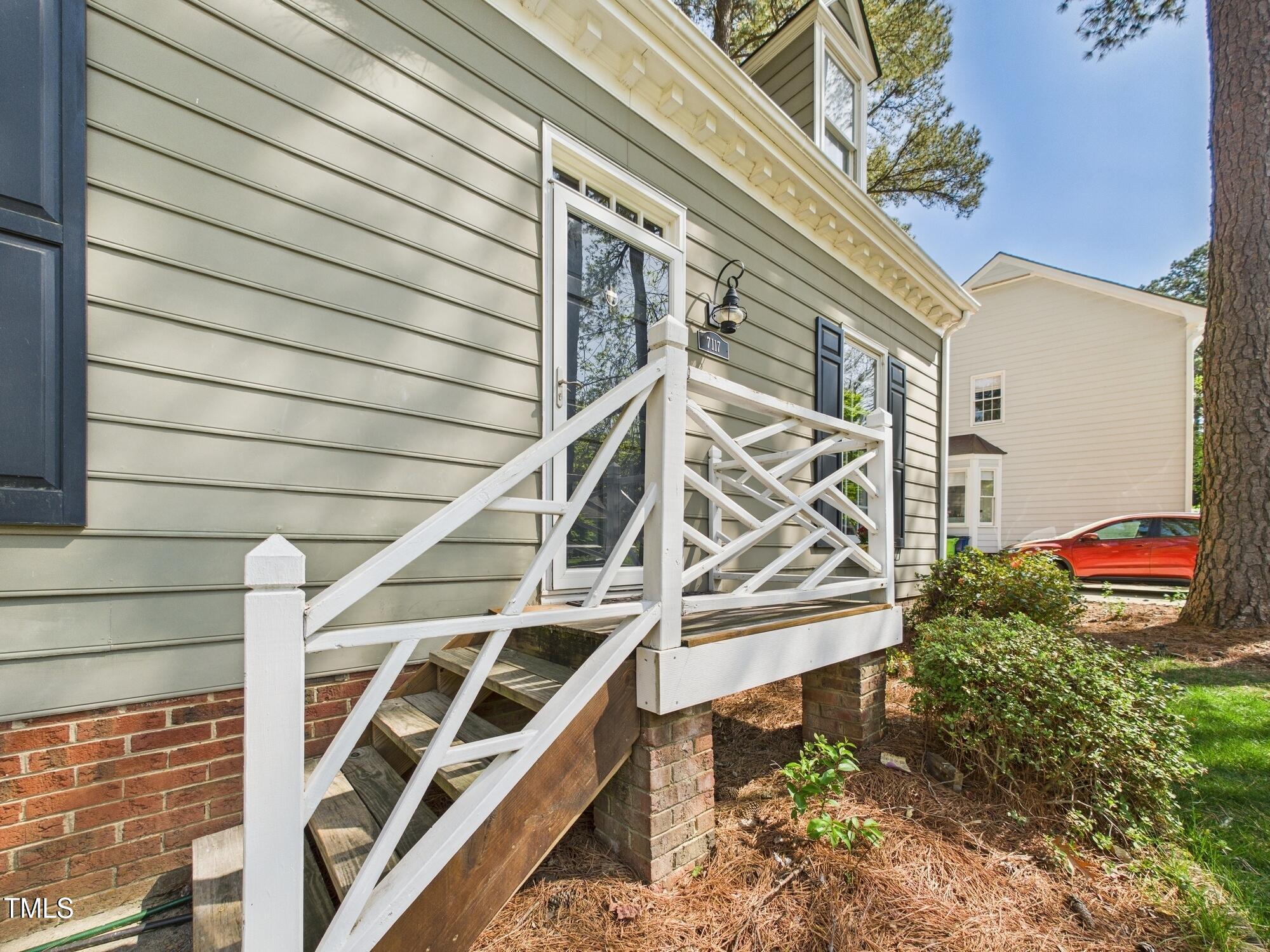 7117 Sandringham Drive Raleigh, NC 27613 - Photo 7 of 54 a view of an entryway with a house